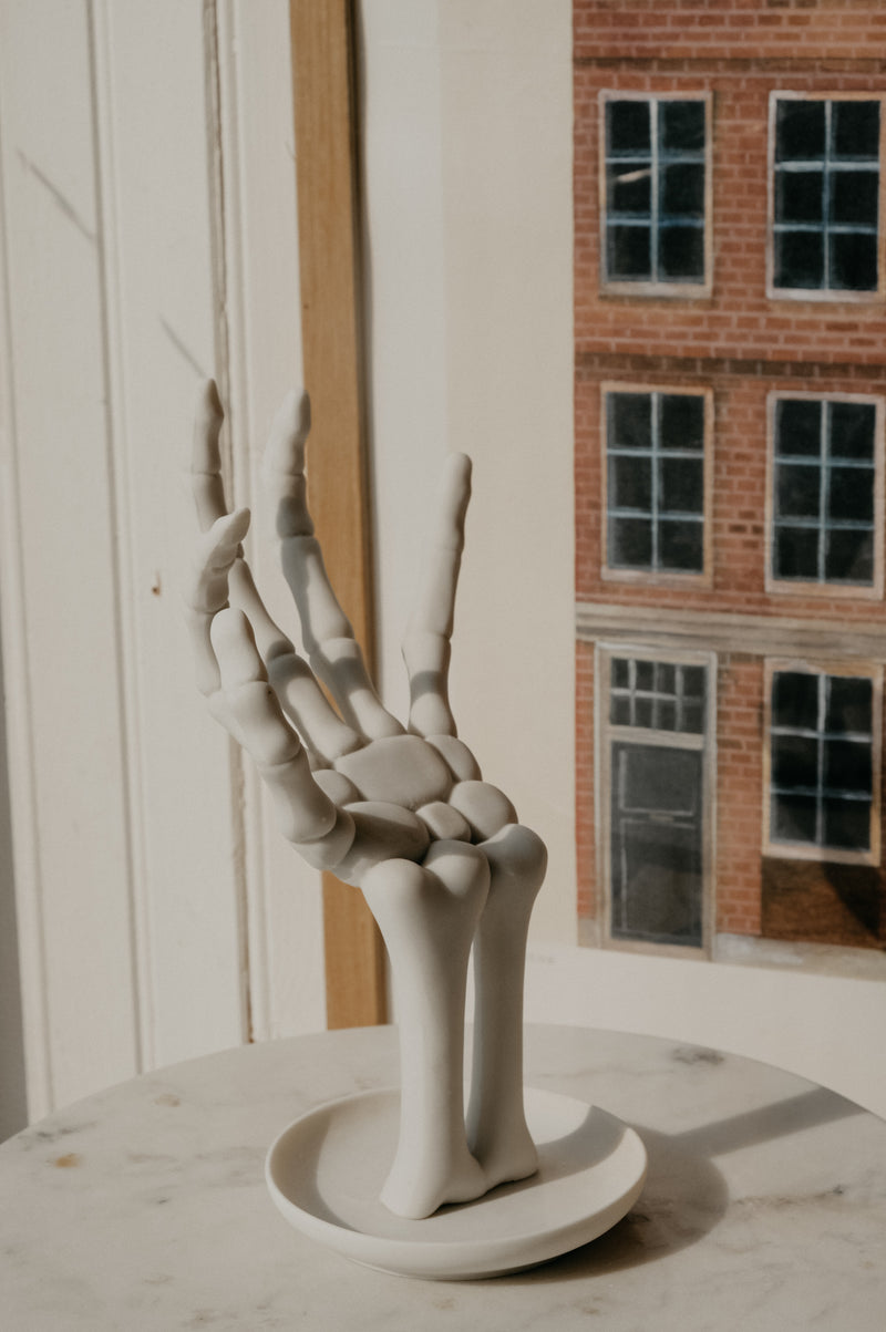 Hollie Skeleton Matt White Hand Holder